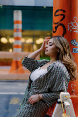 Urban Fashion: Stylish Woman in City Street, Confident and Chic