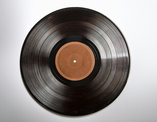 A classic worn black vinyl record with a brown label is displayed on a white background.
