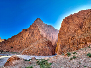 Fototapeta premium Stunning Todra Gorge under a Clear Blue Sky, Morocco