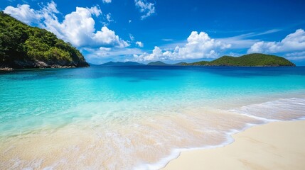 Obraz premium Crystal clear waters gently lap against a sandy shore, framed by vibrant green hills. Fluffy white clouds float in a bright blue sky, creating a perfect tropical paradise