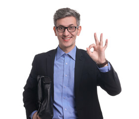 Businessman with briefcase showing okay gesture on white background