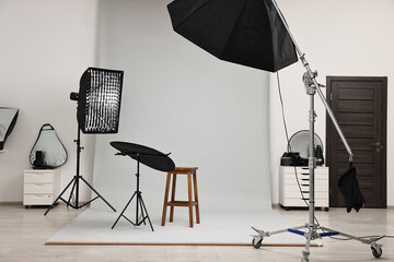 Professional lighting equipment setup in modern photo studio