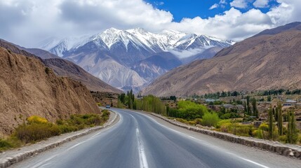 Naklejka premium Mountain Road Winding Through A Village In The Valley