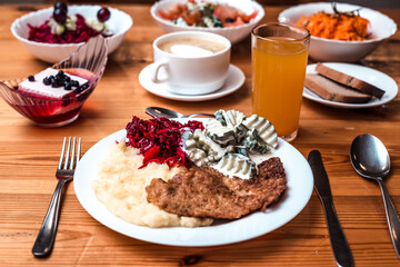 Wooden Table Set with Diverse Meal and Vibrant Side Dishes