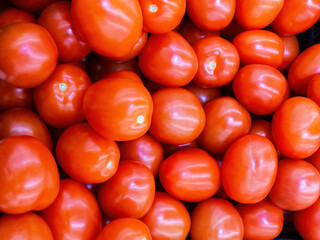 Pile of red juicy tomatoes