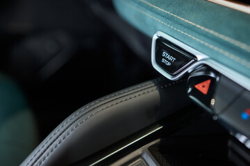 The image displays a detailed view of a cars start stop button