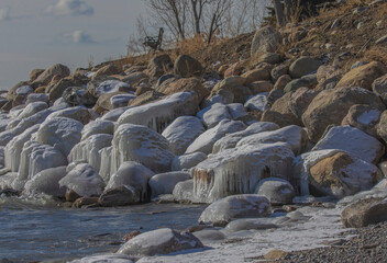 Snow Covered And Icy Rocks