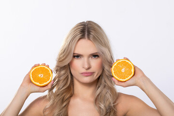 A Woman Holding Fresh Oranges with a Bold Expression, Radiating Energy and Joyfulness