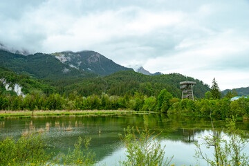 View over the bird sanctuary with observation tower in Pflach, Austria