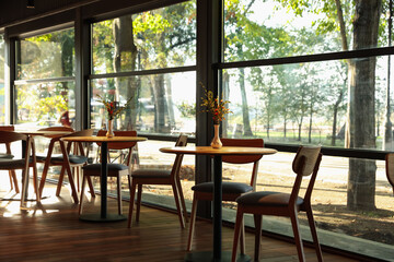 Stylish cafe with large windows. Interior design