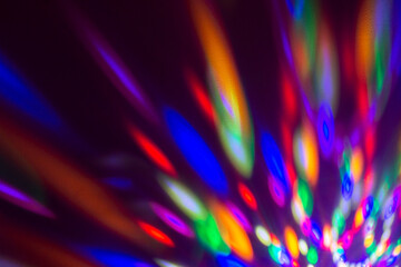 Rainbow light leaks on dark background