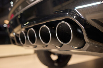 A Close Up View Showcasing the Impressive Dual Exhaust Pipes Found on a Stylish Vehicle Model