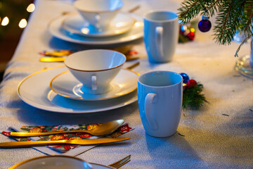 Christmas Eve table setting with elegant decor and festive elements in a cozy home environment