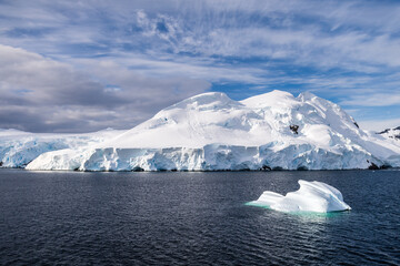 A tranquil Antarctic landscape, near Graham passage along Charlotte Bay, highlighting stark...
