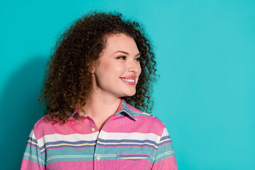 Fototapeta premium Photo of young brunette wavy haired happy girl wearing striped t shirt looking novelty opening beauty salon isolated on aquamarine color background