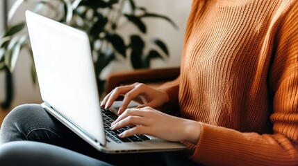 Naklejka premium Cozy home office, woman working on laptop, indoor plants, natural light, window view, comfortable seating, productivity, remote work, green environment, soft focus, warm tones, casual attire, peaceful