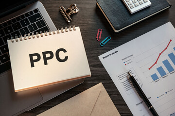 There is notebook with the word PPC. It is an abbreviation for pay-per-click as eye-catching image.