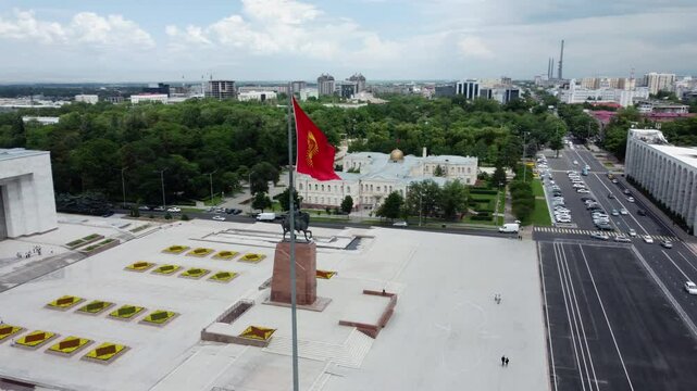 Low aerial shot flying over Ala Too Square in the center of Bishkek, Kyrgyzstan.