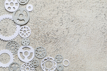 Different paper gears on grey background