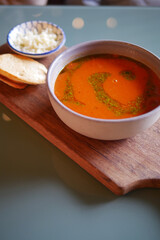 A Delicious and Flavorful Bowl of Spicy Soup Accompanied by Tasty AddOns