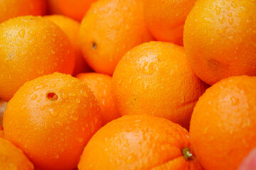 close up of slice of orange fruits in a bowl 