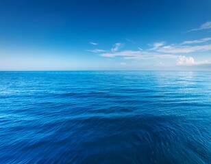 Obraz premium beautiful blue ocean with a calm and peaceful mood the water is still and the waves are gentle creating a serene atmosphere the blue color of the water is calming and soothing