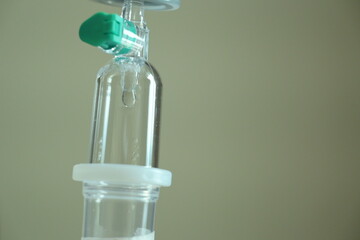 saline solution drip for patient and infusion pump in hospital, close up equipment of medicine