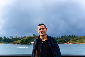 Fototapeta premium People smiling. Latin man happy on vacation visiting Colombian towns and traveling. Excursions and trips.