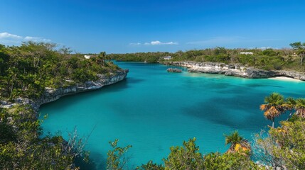 Fototapeta premium A serene coastal landscape featuring turquoise waters and lush greenery under a clear blue sky.