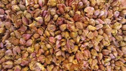 Red Shallots Displayed on Traditional Market Stall for Cooking Use