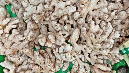 Fresh Turmeric Roots Displayed at Traditional Market