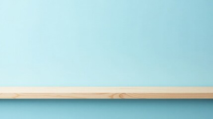 Empty light wood shelf against a pale blue wall background ideal for product display
