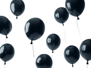 Black balloons floating in the air gracefully.