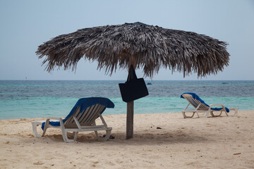 Club Amigo Atlantic resort hotel, beach umbrellasl and the caribbean shore in Guardalavaca, Cuba