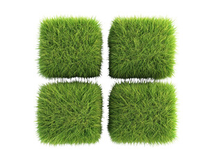 Four green cubes covered in vibrant grass.