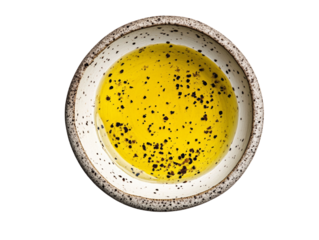 Fresh olive oil with spices in a bowl.