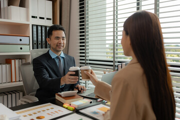 a group of businessman is meeting in the office in the morning with their coffee, colleagues sit together having some coffee in the workplace, businesspeople discussion about their new project