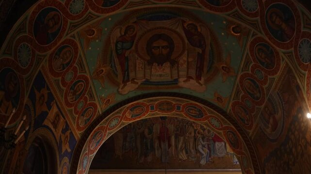 neoclassical Nativity Cathedral in Chisinau, capital city of Moldova revealing christian painting on the ceiling tilt down