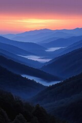 Sunrise illuminates the valleys and mountains in a serene landscape at dawn