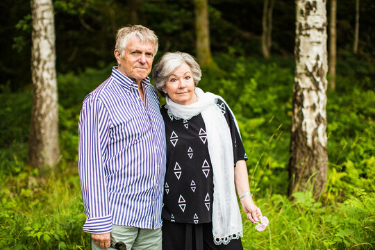 An older Swedish couple enjoying the Swedish summer outside in the nature