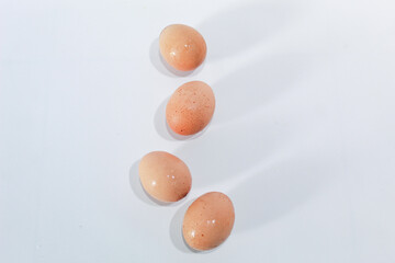 Fresh eggs brownish color isolated on white background