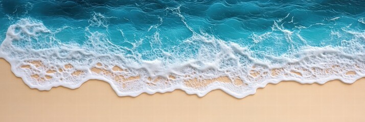 Beautiful Aerial View of Gentle Ocean Waves Washing Over Sandy Beach with Vibrant Blue Water and Soft Foam Patterns Captured in High Detail
