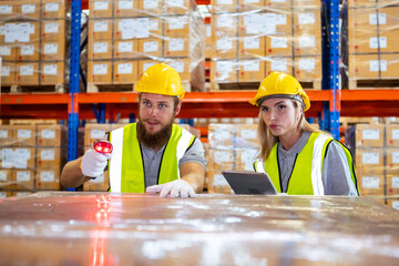 Male and Female factory company employee scanning box checking number of products on goods shelves with tablet in warehouse. Worker in logistics and distribution. Import-export warehouse.