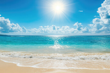 A beautiful beach with a clear blue ocean and a bright sun shining on the water