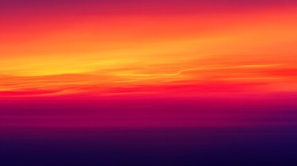 Fototapeta premium Vibrant and Striking Sunset Colors Blending Gradually from Yellow to Orange to Magenta Over a Peaceful Horizon in a Serene Landscape