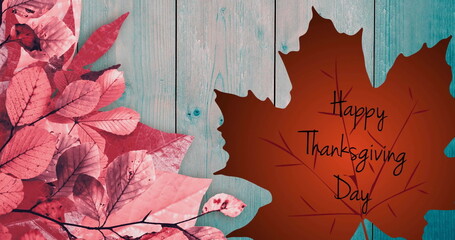 Image of happy thanksgiving day text over autumn leaves background