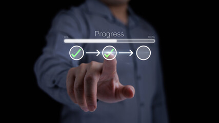Businessman touching on tick check mark in checklist with progress bar loading status in concept of project work progress tracking and project management.