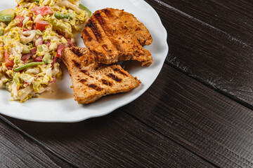 Healthy eating concept, fresh salad with vegetables and grilled turkey