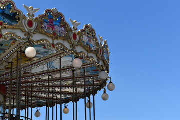 Merry-go-round carousel with blue skies