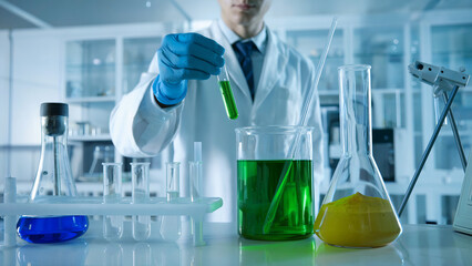 Scientist Conducting Experiment in Laboratory, Green Liquid Test Tube, Chemistry Research, Science and Innovation